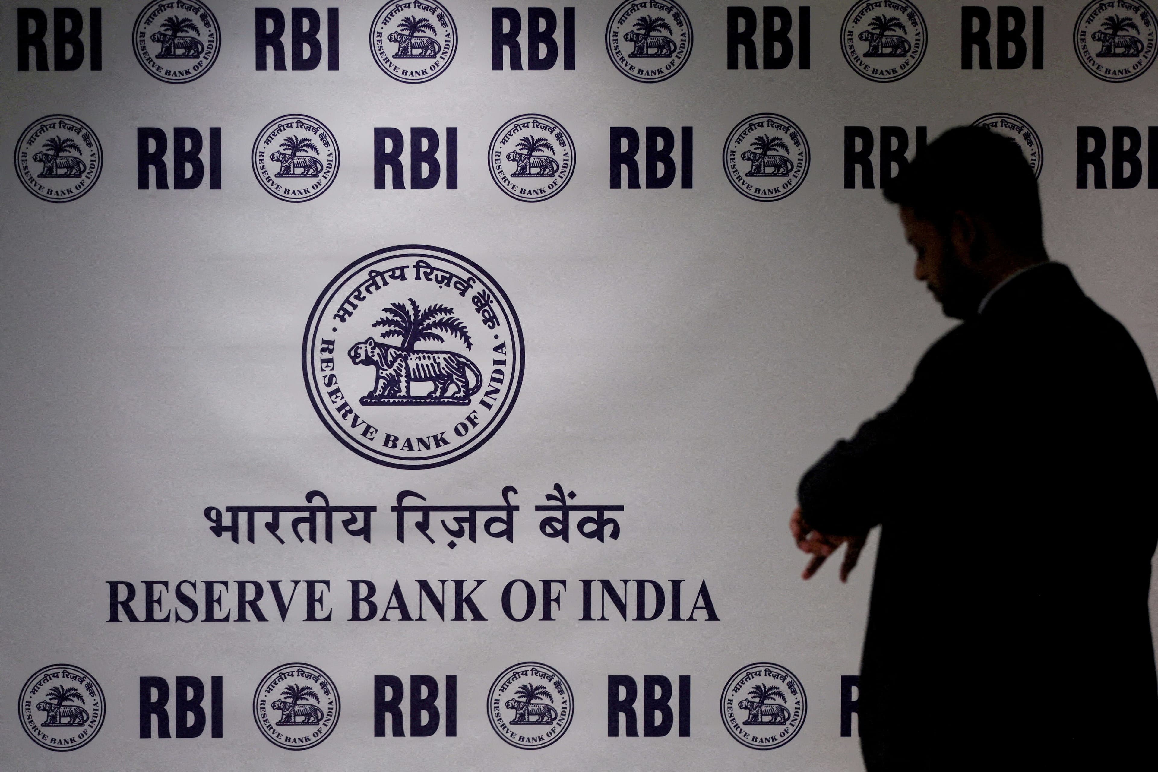 RBI bond sales, FX intervention help halve India's cash overhang